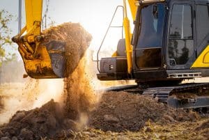 industrial storage in sulphur la Close-up of excavator at construction site. Backhoe digging soil for earthwork and construction business. Excavating machine at work. Heavy machinery for earth moving and construction site development